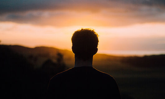 Man Looking into Sunset